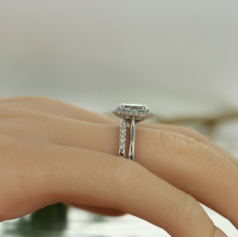 oval aquamarine and diamond bridal rings