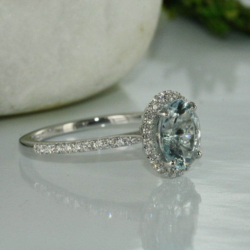 halo diamond and gemstone engagement ring